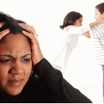 woman holding head stress types